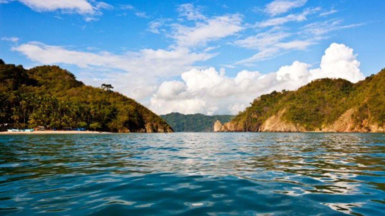 Nicoya Peninsula inlet with forested hills and tropical coastline
